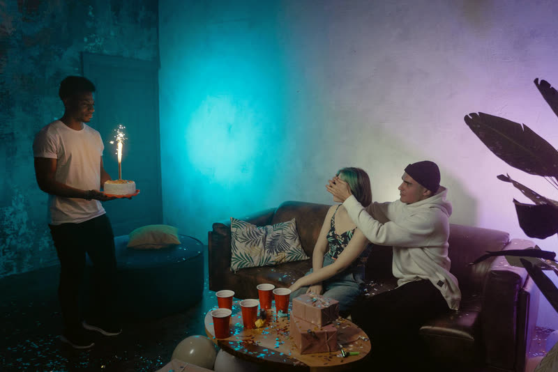 Friends surprising someone at a party